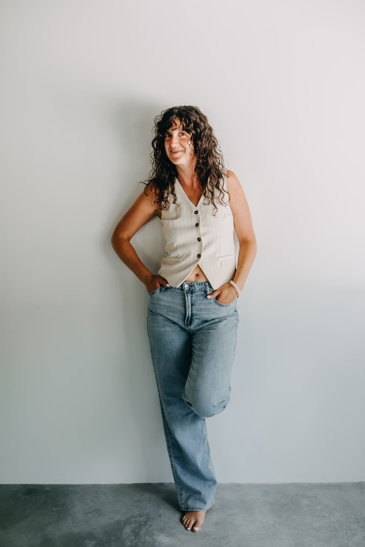 Shelby Foster standing in a naturally reflective portrait